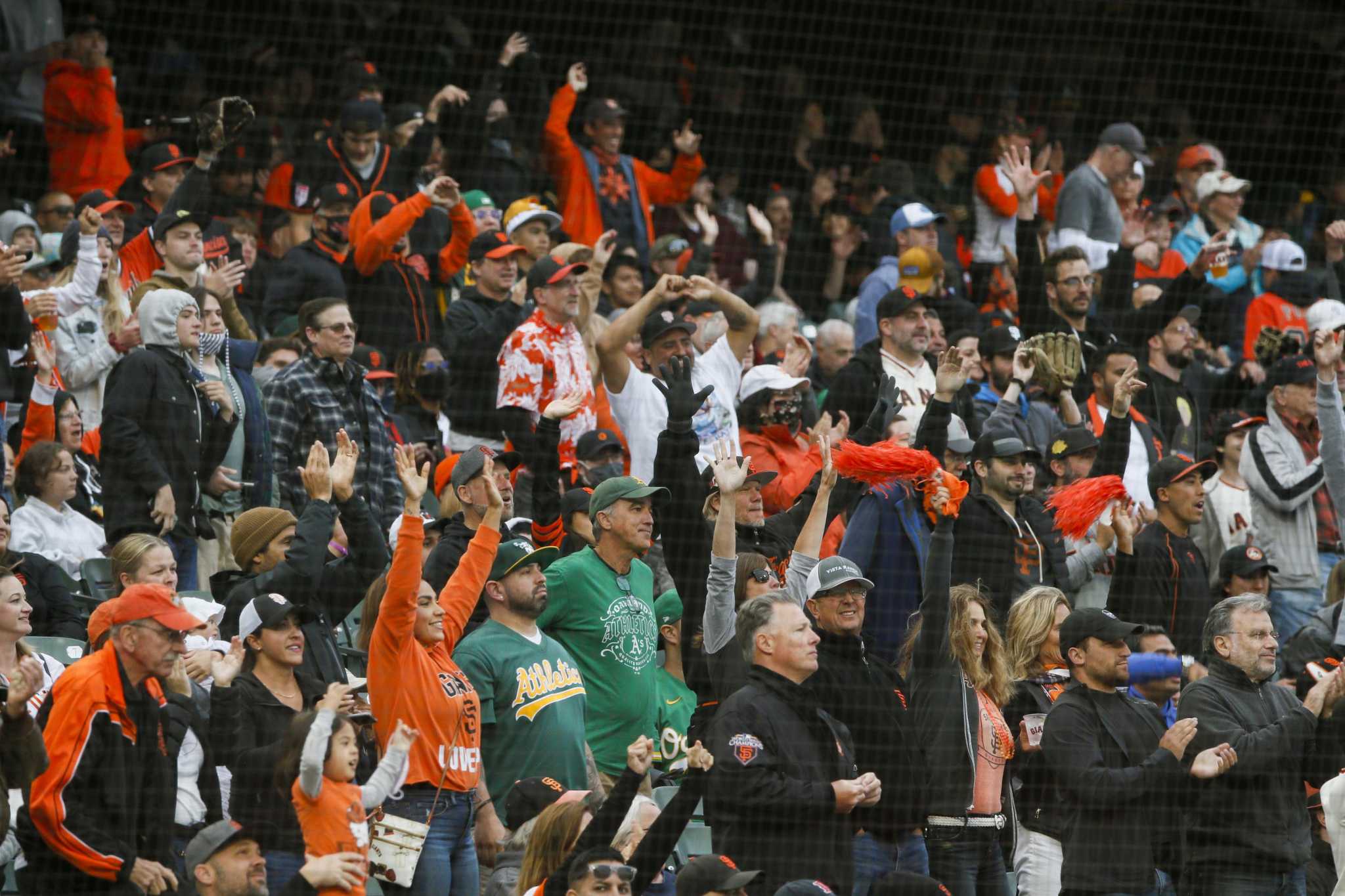 Giant crowd of Astros fans saving a woman's hat is Houston at its