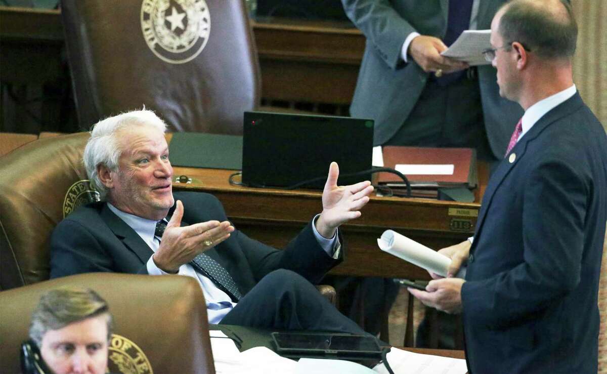 Rep. Lyle Larson, R- San Antonio, talks on the floor with another representative as lawmakers on the House floor in this May 2019 photo. The San Antonio representative is disgusted with both the lieutenant governor and the two-party system, columnist Gilbert Garcia writes.