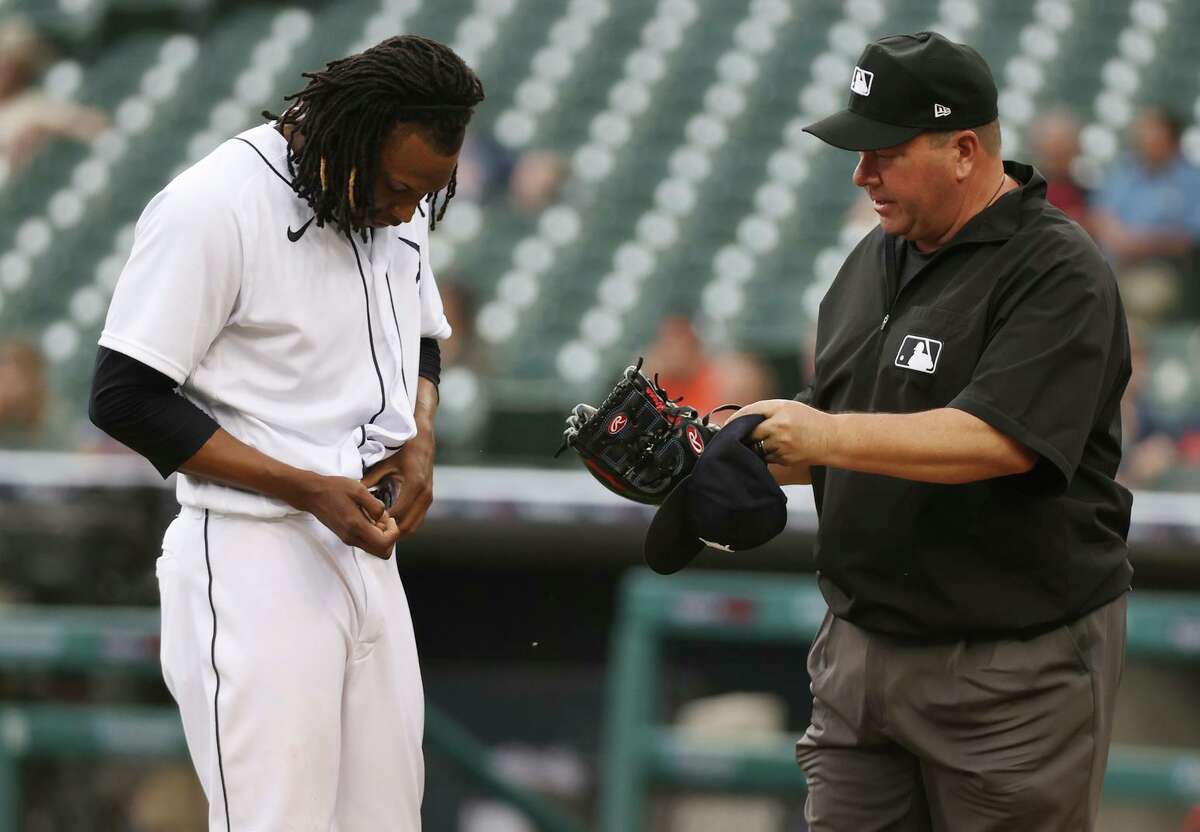 Detroit Tigers pitcher Jose Urena is checked for illegal substances by first base umpire Sam Holbrook after pitching the first inning against the Houston Astros on Thursday. Urena stayed in the game.