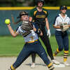 Midland High's Gabby Schloop throws to first during a May 18, 2021 game against Dow High. 