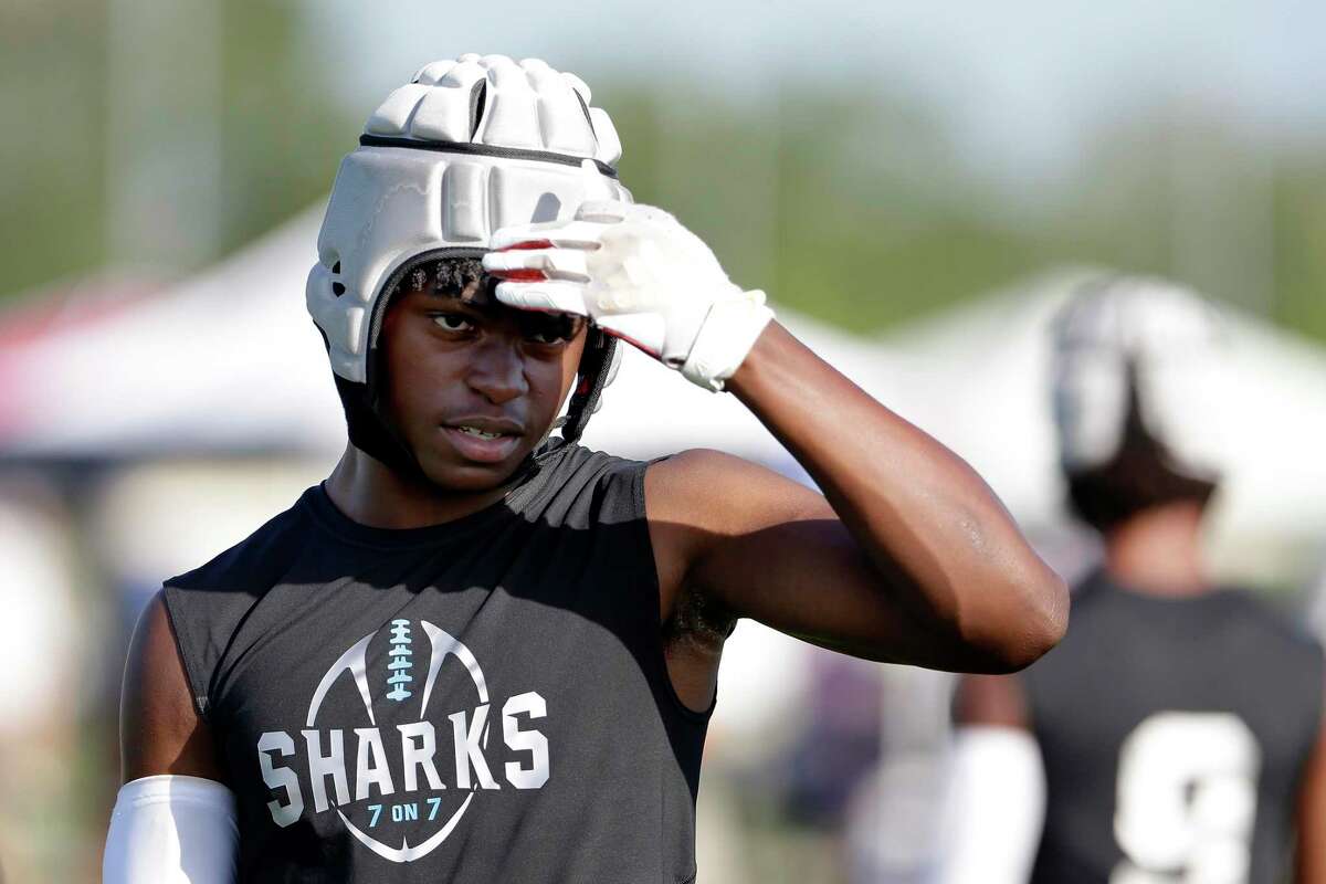 An Alvin Shadow Creek player shields from the sun during their first round game against Lake Travis in the 7-on-7 state tournament held at Veterans Park Saturday, Jun. 26, 2021 in College Station, TX.