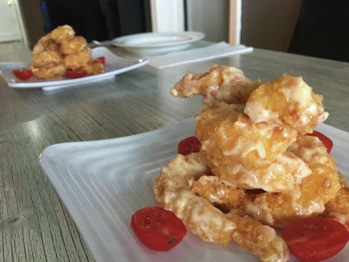 A platter of rock shrimp with a spicy cream sauce at the new Toka Asian Kitchen, 996 State St. in New Haven on June 25, 2021. Toka brings a full range of Indonesian food to New Haven for the first time, along with other Chinese, Japanese and Singaporean-influenced dishes.