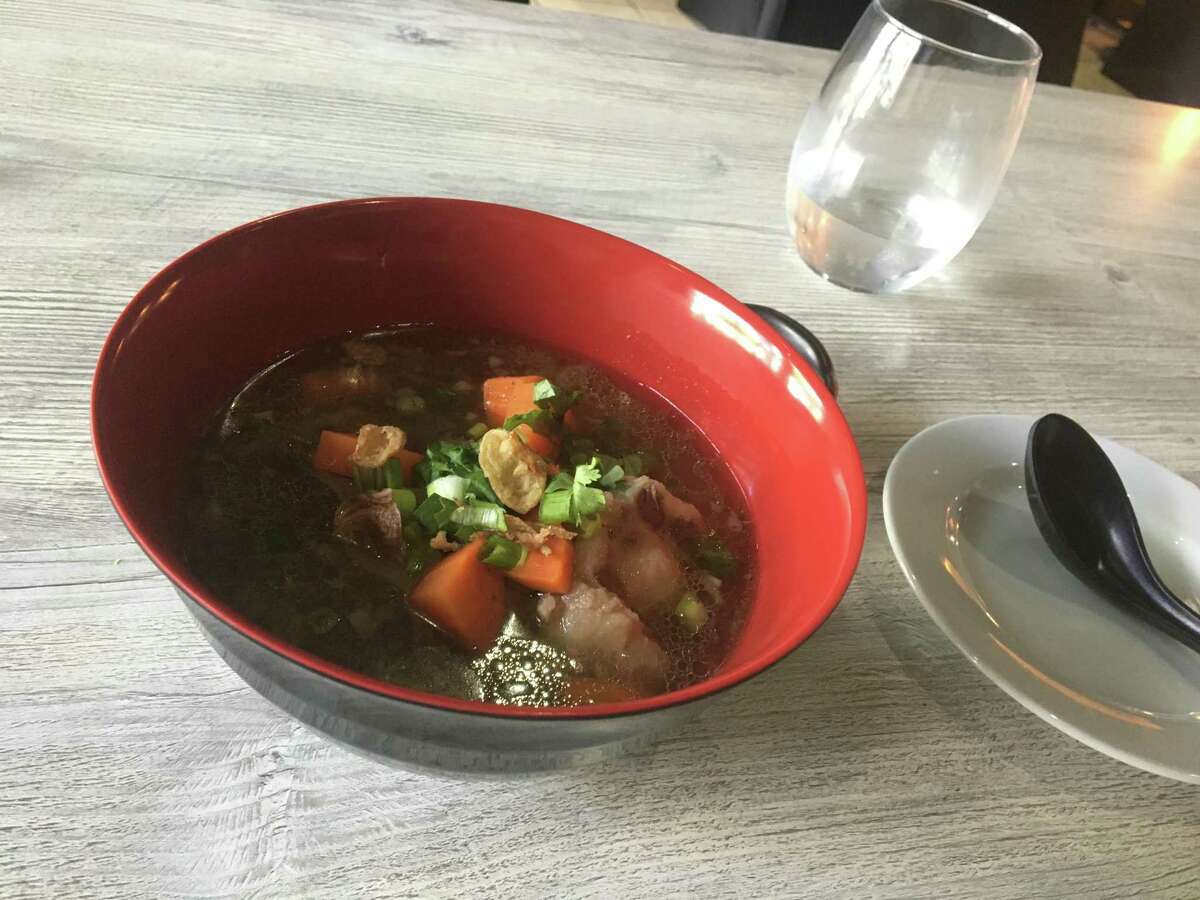 A bowl of buntut -- aromatic Indonesian oxtail soup -- at the new Toka Asian Kitchen, 996 State St. in New Haven on June 23, 2021. Toka brings a full range of Indonesian food to New Haven for the first time, along with other Chinese, Japanese and Singaporean-influenced dishes.