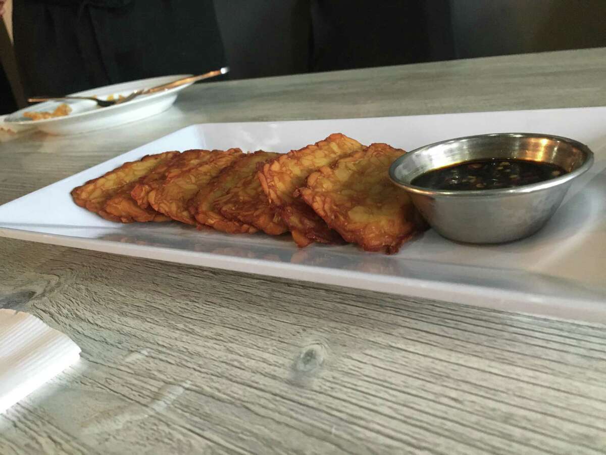 A platter of tempe goreng, or fried soybean cake, at the new Toka Asian Kitchen, 996 State St. in New Haven on June 25, 2021. Toka brings a full range of Indonesian food to New Haven for the first time, along with other Chinese, Japanese and Singaporean-influenced dishes.