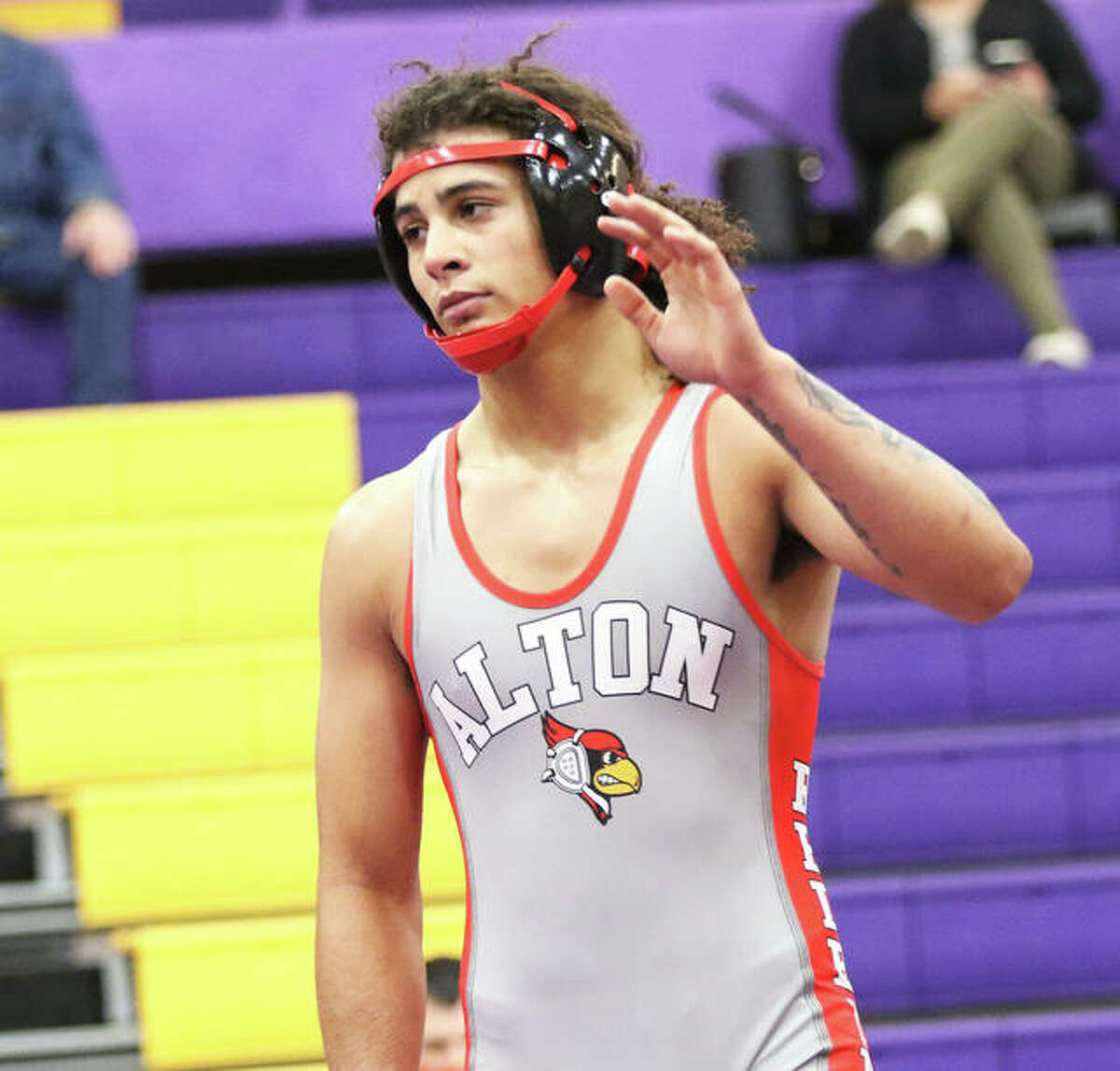 Alton senior Damien Jones, shown after a victory earlier in the season, earned a fifth-place medal at 182 pounds Saturday in the IWCOA Class 3A wrestling state meet in Springfield. Jones finished his season with a 25-3 record.