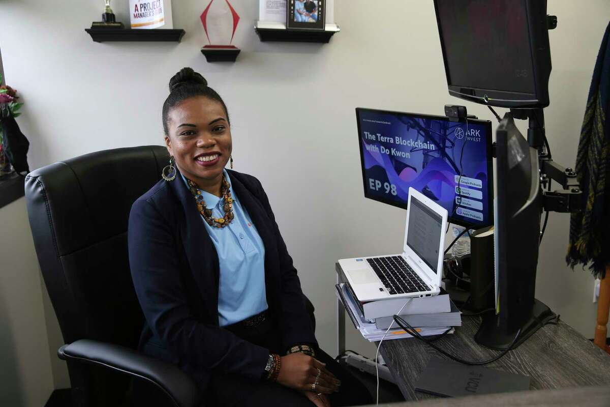 La Juana Chambers Lawson, owner and principal of Tacit Growth Strategies, works in her office Friday, June 25, 2021.
