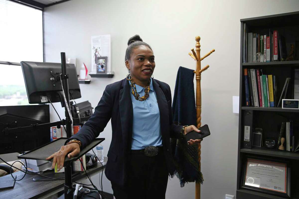 La Juana Chambers Lawson, owner and principal of Tacit Growth Strategies, works in her office Friday.