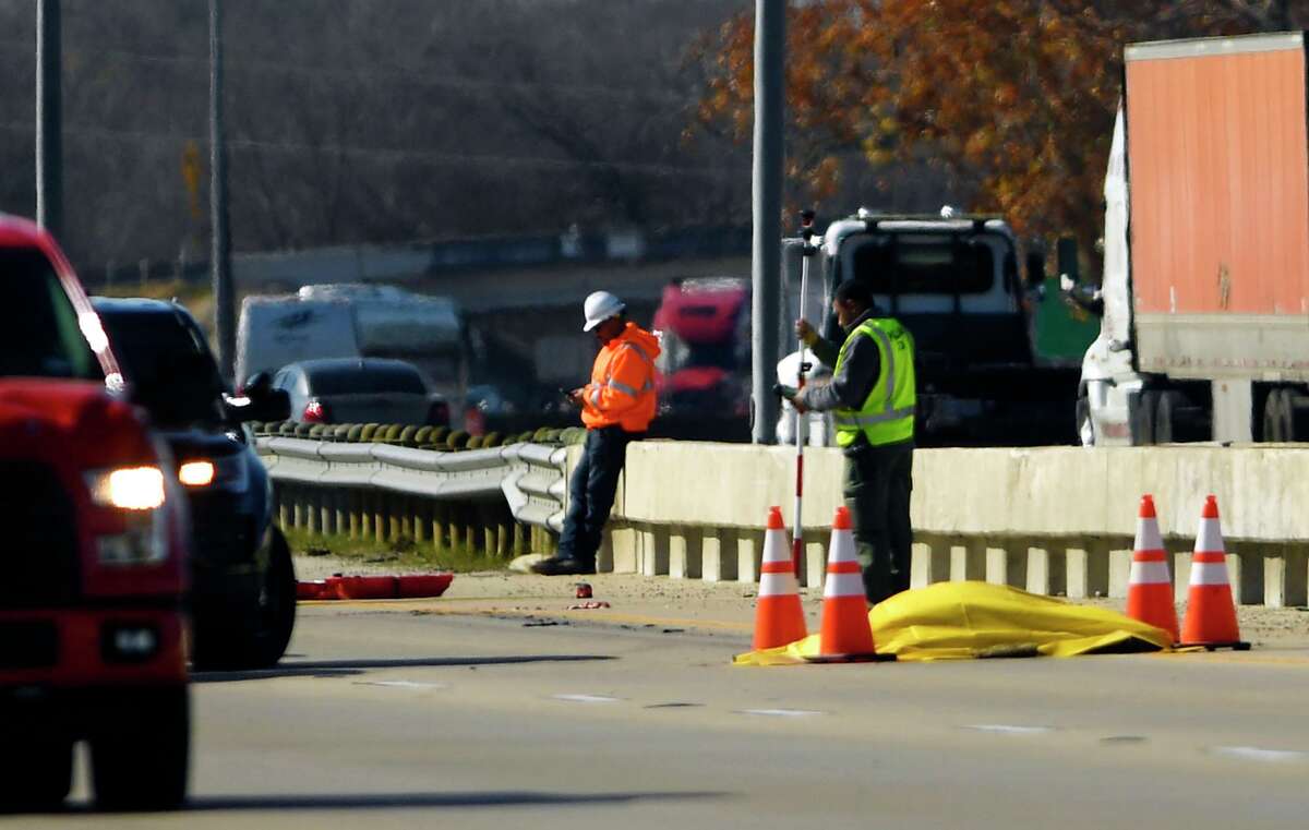 The body of a 19-year-old man rests on Interstate 35 North near Loop 1604 after he was run over by an 18-wheeler on the Southwest Side on Jan. 3, 2020.