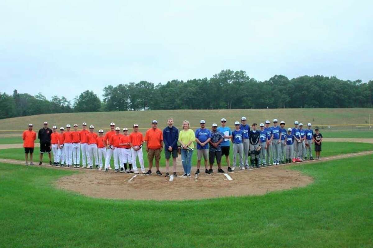 Manistee celebrates the memory of umpire Jeff Stewart who died of a heart attack while umpiring a tournament game last year. (Courtesy photo)