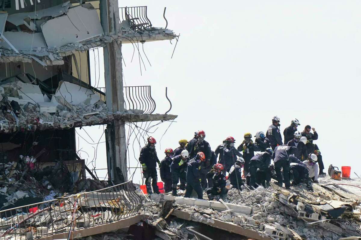 Crews work in the rubble at the Champlain Towers South Condo, Sunday, June 27, 2021, in Surfside, Fla. Many people were still unaccounted for after Thursday's collapse.