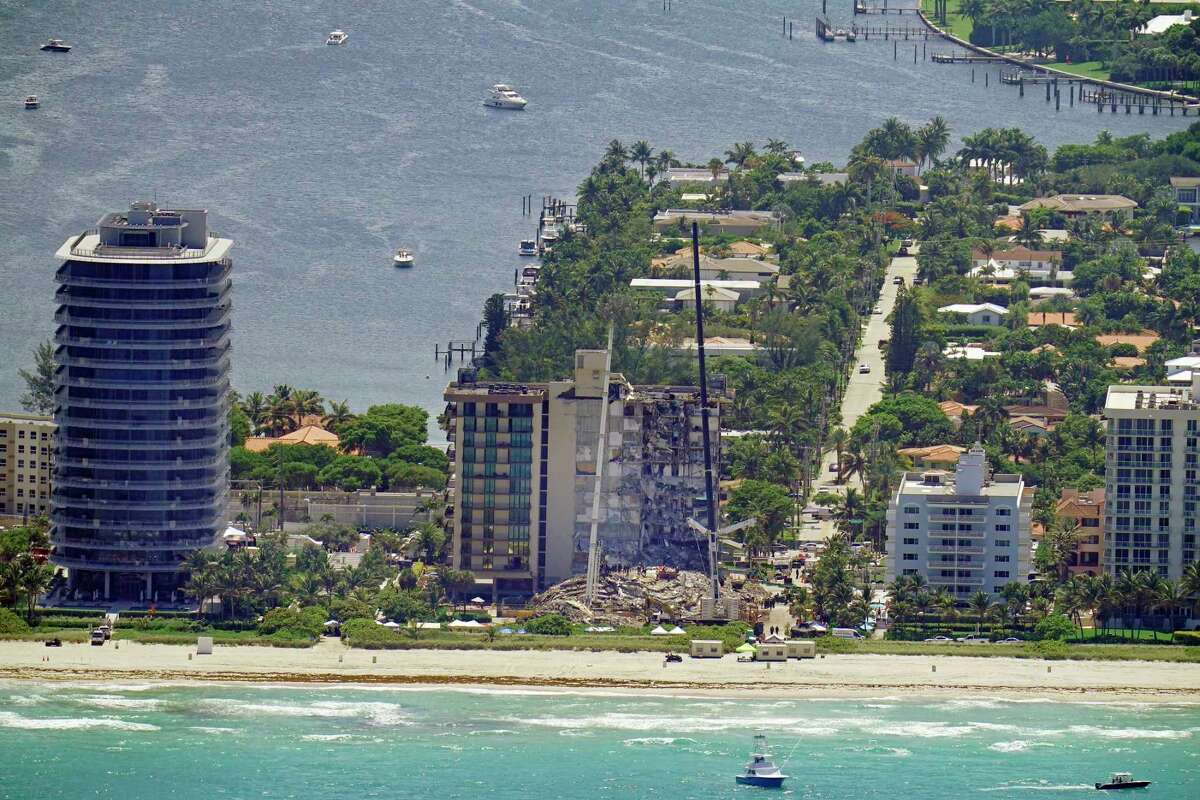 This aerial image shows an oceanfront condo building that partially collapsed three days earlier, resulting in fatalities and many people still unaccounted for, in Surfside, Fla., Sunday, June 27, 2021.