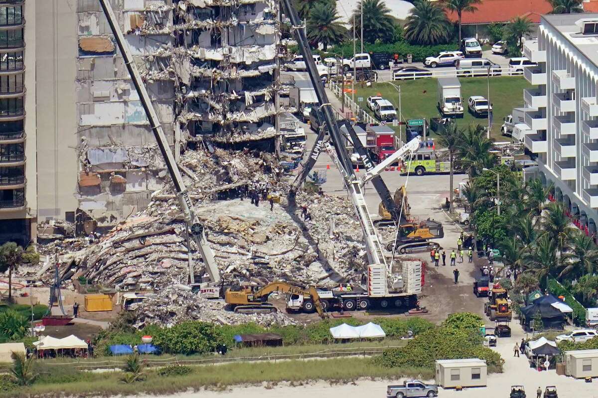 This aerial image shows an oceanfront condo building that partially collapsed three days earlier, resulting in fatalities and many people still unaccounted for, in Surfside, Fla., Sunday, June 27, 2021.