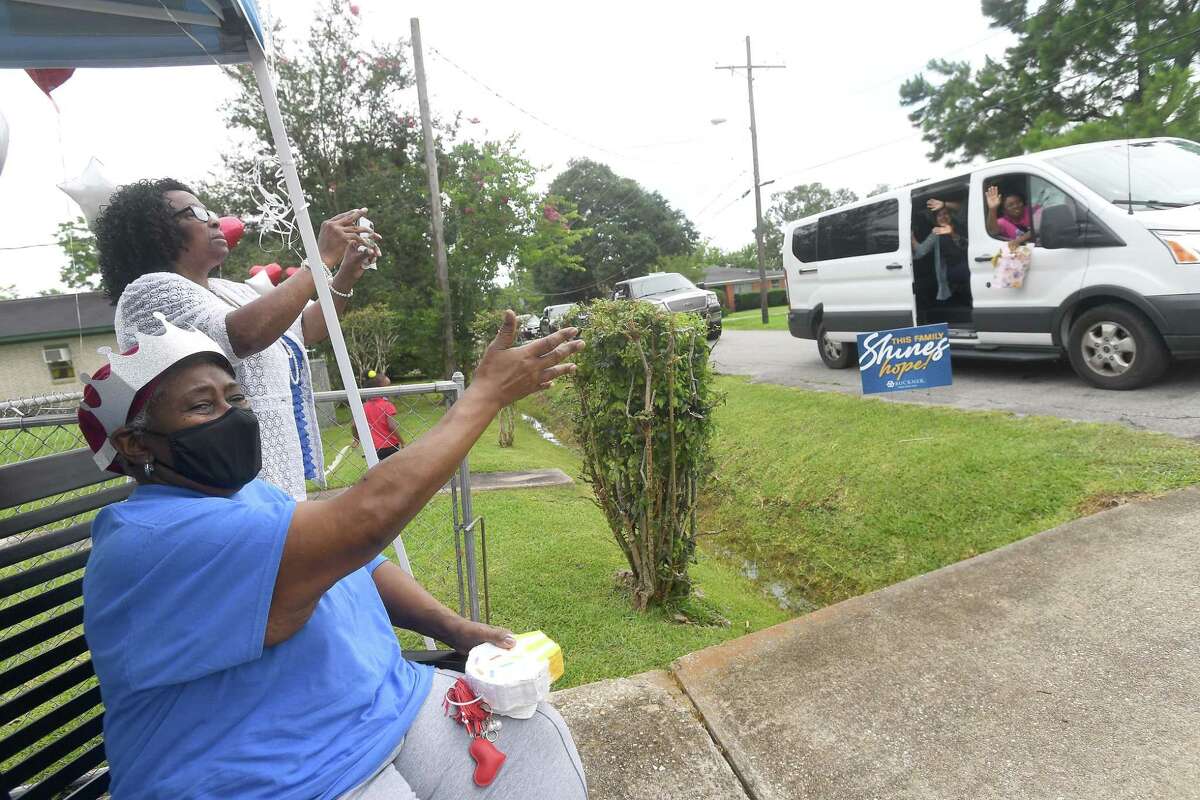 Diverna Abatte waves and blows kisses during a drive-by parade and celebration at her home to honor her 42 years serving as a foster parent. Abatte fostered with Buckner since 2002, but began her lifelong ministry of fostering with Jefferson County's Child Protective Services in 1979. In all, roughly 175 children have crossed her doorstep throughout the years, many. of which she has kept up with over the years. Photo made Wednesday, June 23, 2021 Kim Brent/The Enterprise