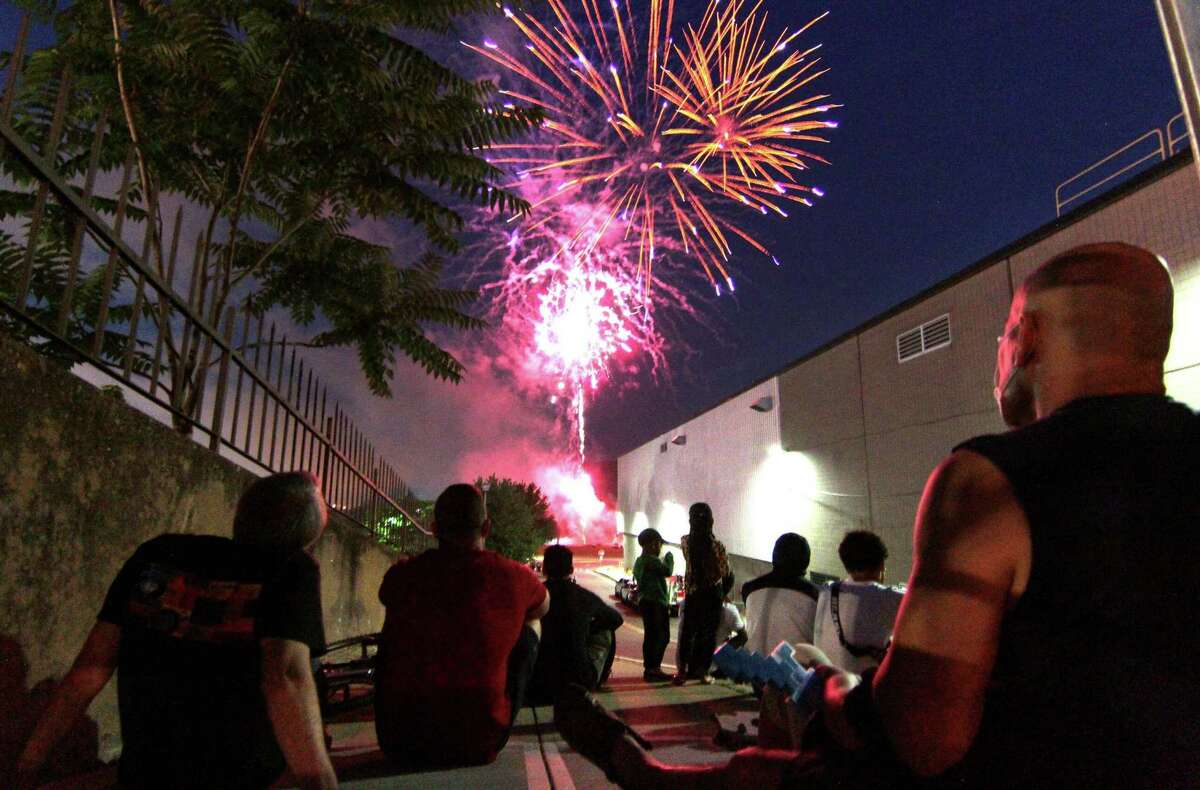 The July 4th holiday fireworks display is held at Veterans Memorial Park in Shelton, Conn., on Wednesday July 8, 2020. Due to the coronavirus pandemic, crowds weren't allowed to gather in the park, but were able to watch from the roads and homes nearby.
