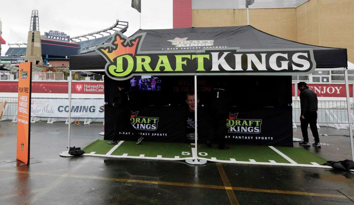 A Draft Kings tent in the parking lot of Gillette Stadium before an NFL football game between the New England Patriots and New York Jets, Sunday, Oct. 25, 2015, in Foxborough, Mass.