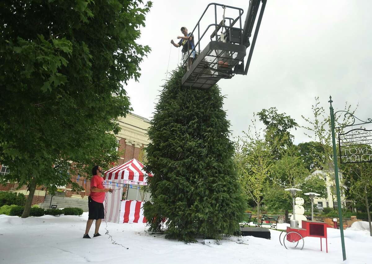 Set decorators transform the New Canaan Town Hall property into a Christmas scene for the filming of the Netflix movie The Noel Diary in New Canaan, Conn. on Sunday, June 27, 2021.