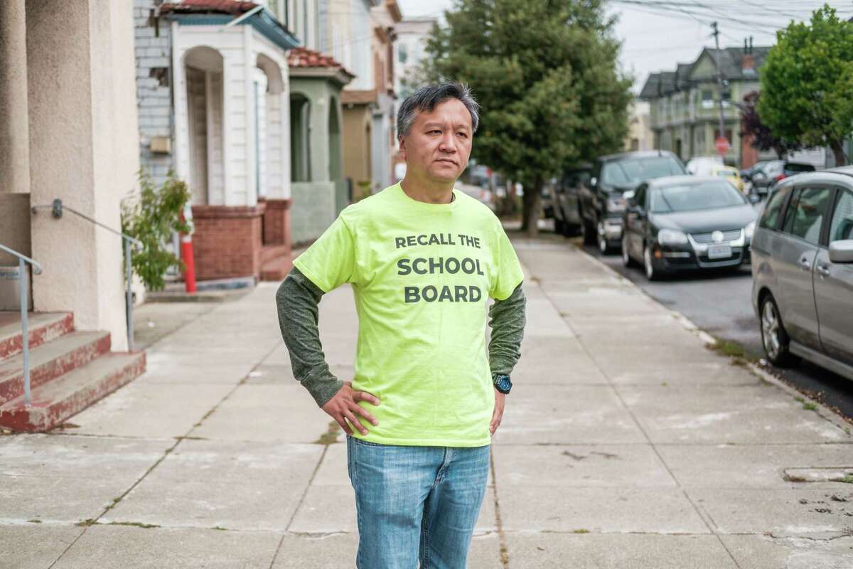 Kit Lam confronted a man who grabbed petitions for a recall of three San Francisco school board members, as captured in a viral video. The state will take over the probe.