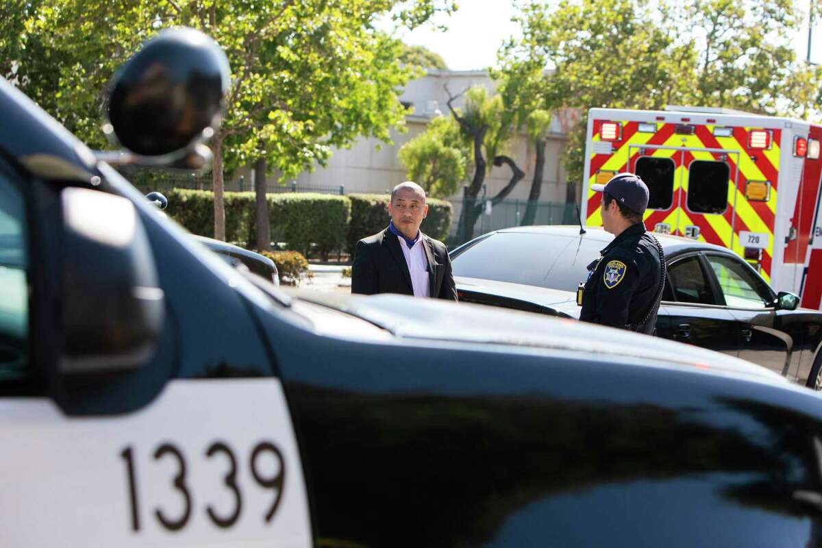 Phong Tran, an Oakland homicide investigator, leaves the crime scene on the 2200 block of Chestnut Street in Oakland, Calif., on Friday, June 25, 2021. One male was pronounced deceased on the scene after police responded to reports of a shooting in West Oakland.