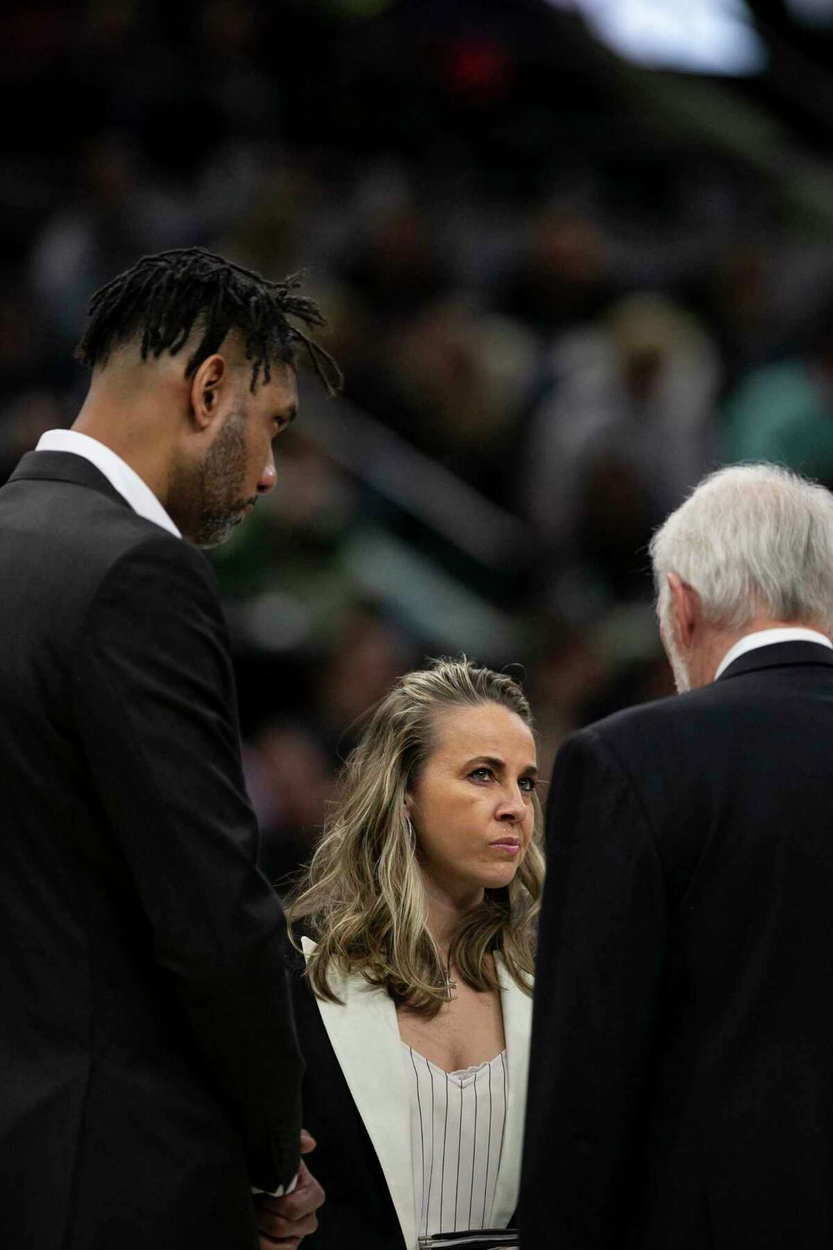 San Antonio Spurs' Assistant Coach Becky Hammon listens to Head Coach Gregg Popovich during a timeout during the Spurs' game against the Bucks at AT&T Center in San Antonio, Texas, Jan. 6, 2020.