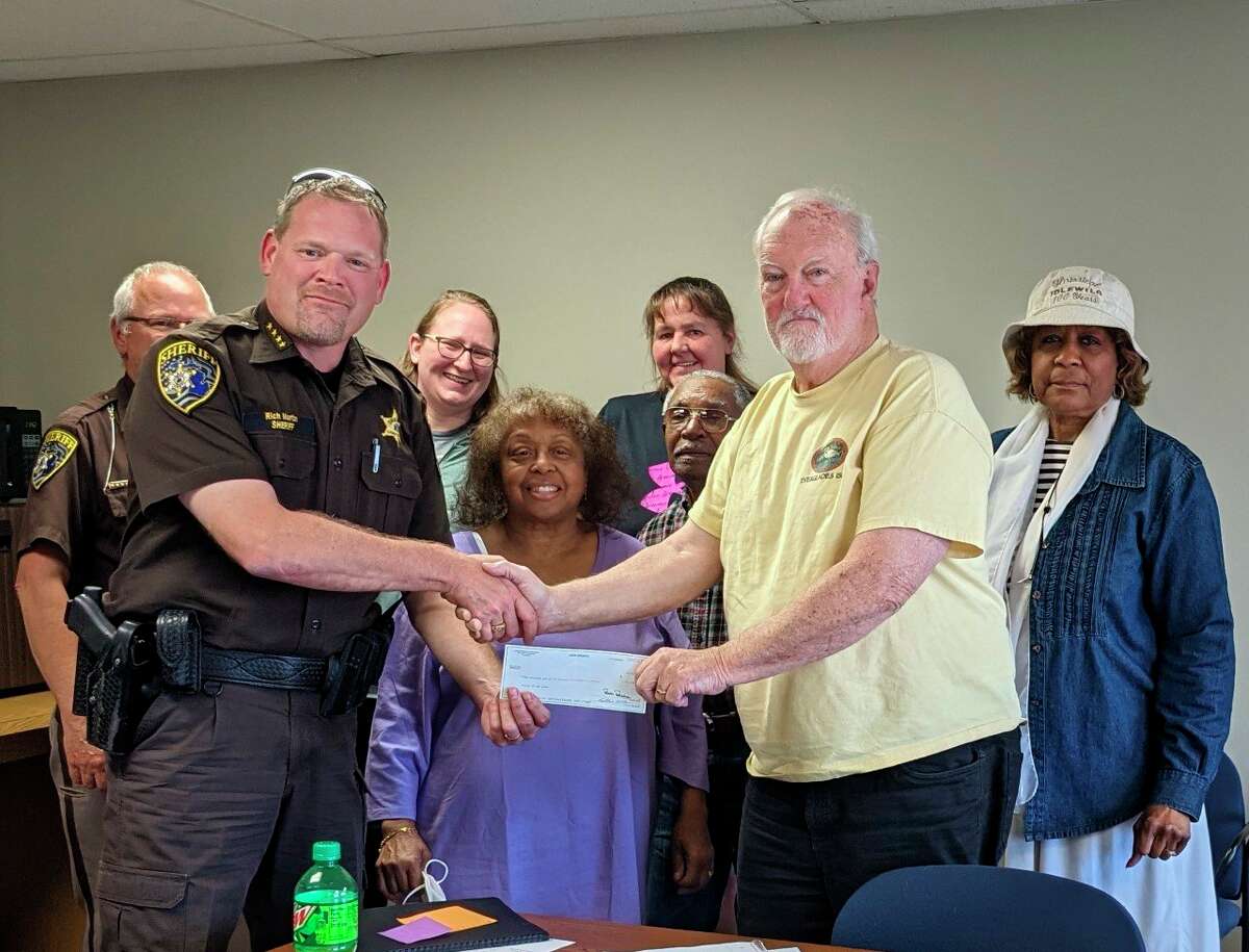 Lake County Sheriff Rich Martin presented the board of directors of the Shrine of the Pies Museum with a donation of $1000 from the Sheriff's Charity Campaign. (Submitted photo)
