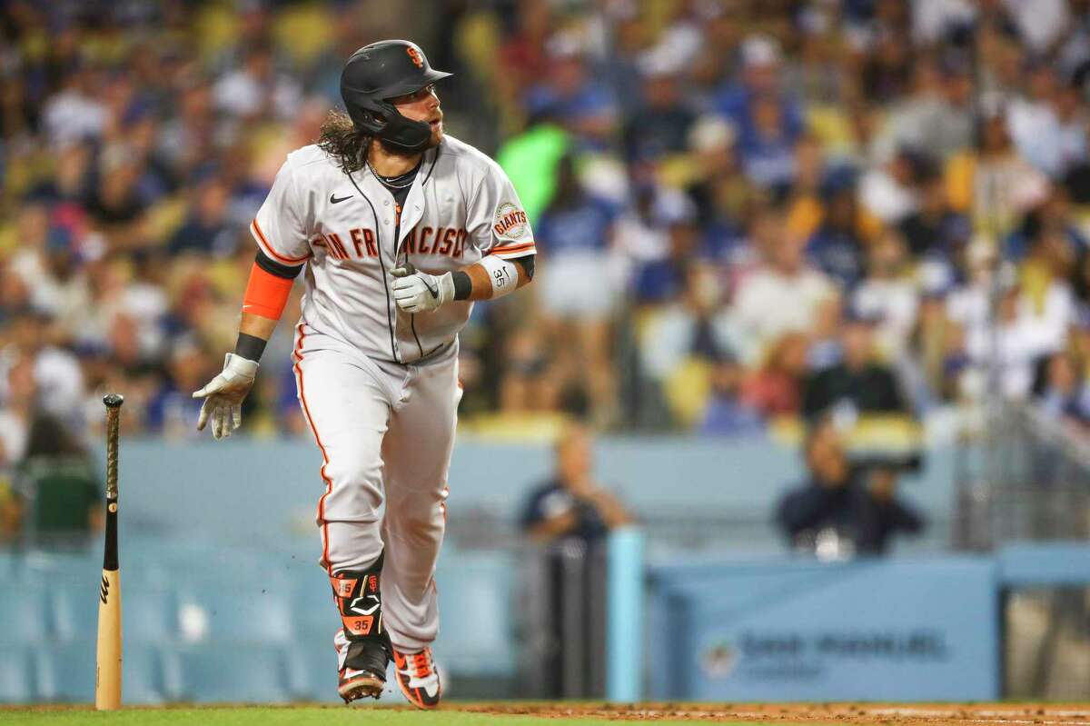 LOS ANGELES, CALIFORNIA - JUNE 28: Brandon Crawford #35 of the San Francisco Giants hits a home run in the sixth inning against the Los Angeles Dodgers at Dodger Stadium on June 28, 2021 in Los Angeles, California. (Photo by Meg Oliphant/Getty Images)