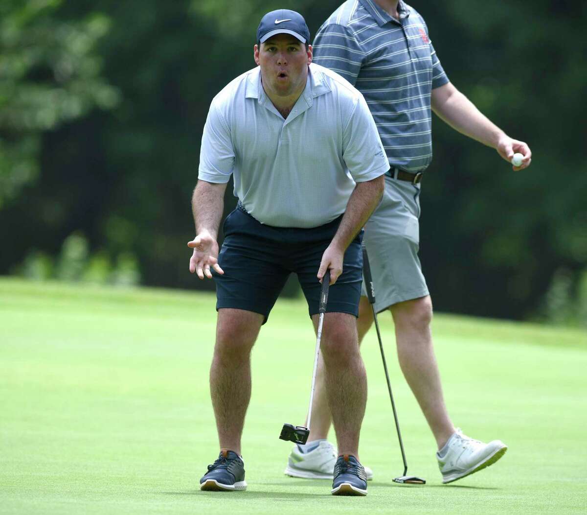 Mark Kelley reacts to a missed putt in the 76th Annual Town Wide Men's Golf Tournament at Griffith E. Harris Golf Course in Greenwich, Conn. Sunday, June 27, 2021.