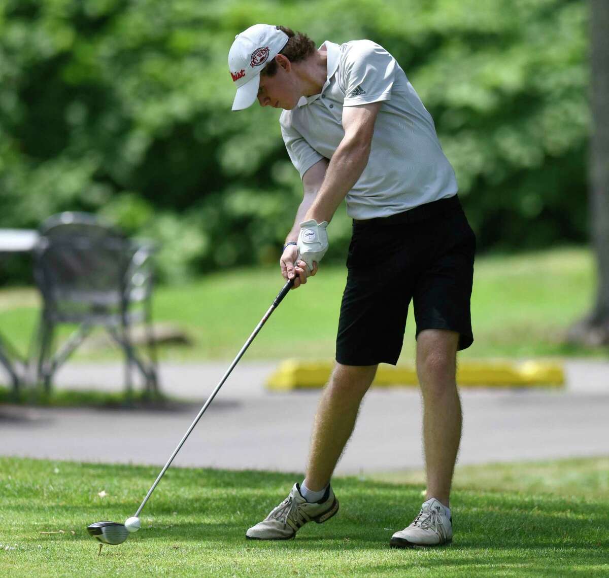 Tyler Sudell tees off on Sunday at Griffith E. Harris Golf Course in Greenwich.