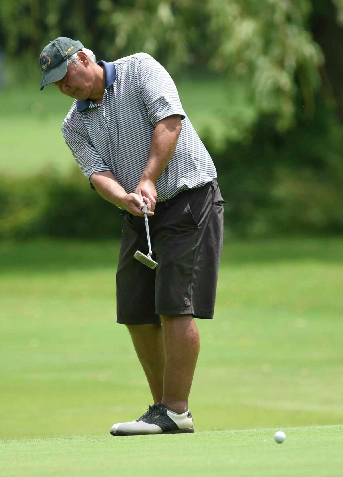 John Byrne putts in the 76th Annual Town Wide Men's Golf Tournament at Griffith E. Harris Golf Course in Greenwich, Conn. Sunday, June 27, 2021.