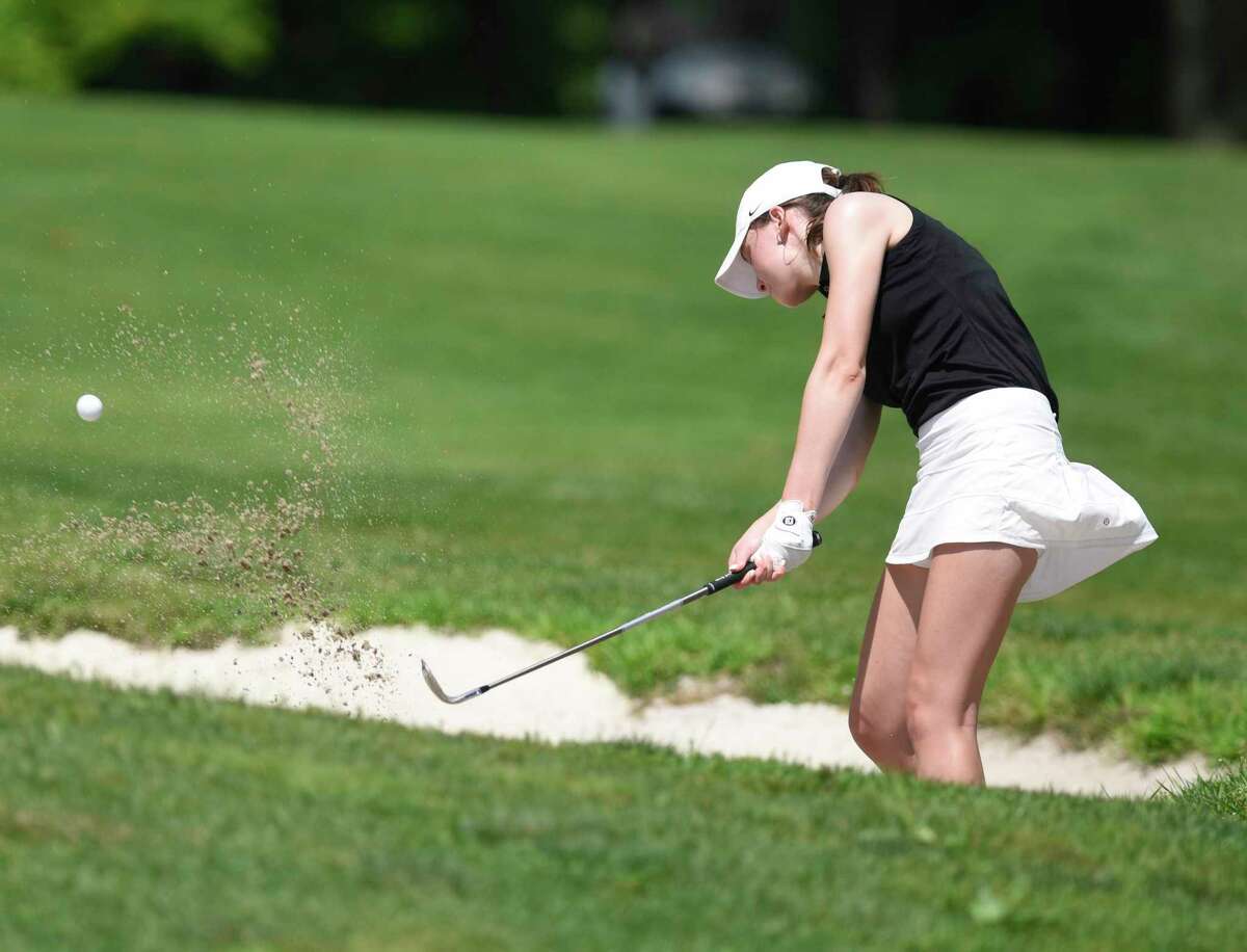 Sydney Nethercott hits out of a bunker in the Town Wide Women's Golf Tournament at Griffith E. Harris Golf Course. Nethercott won the Town Wide flight with a score of 70.