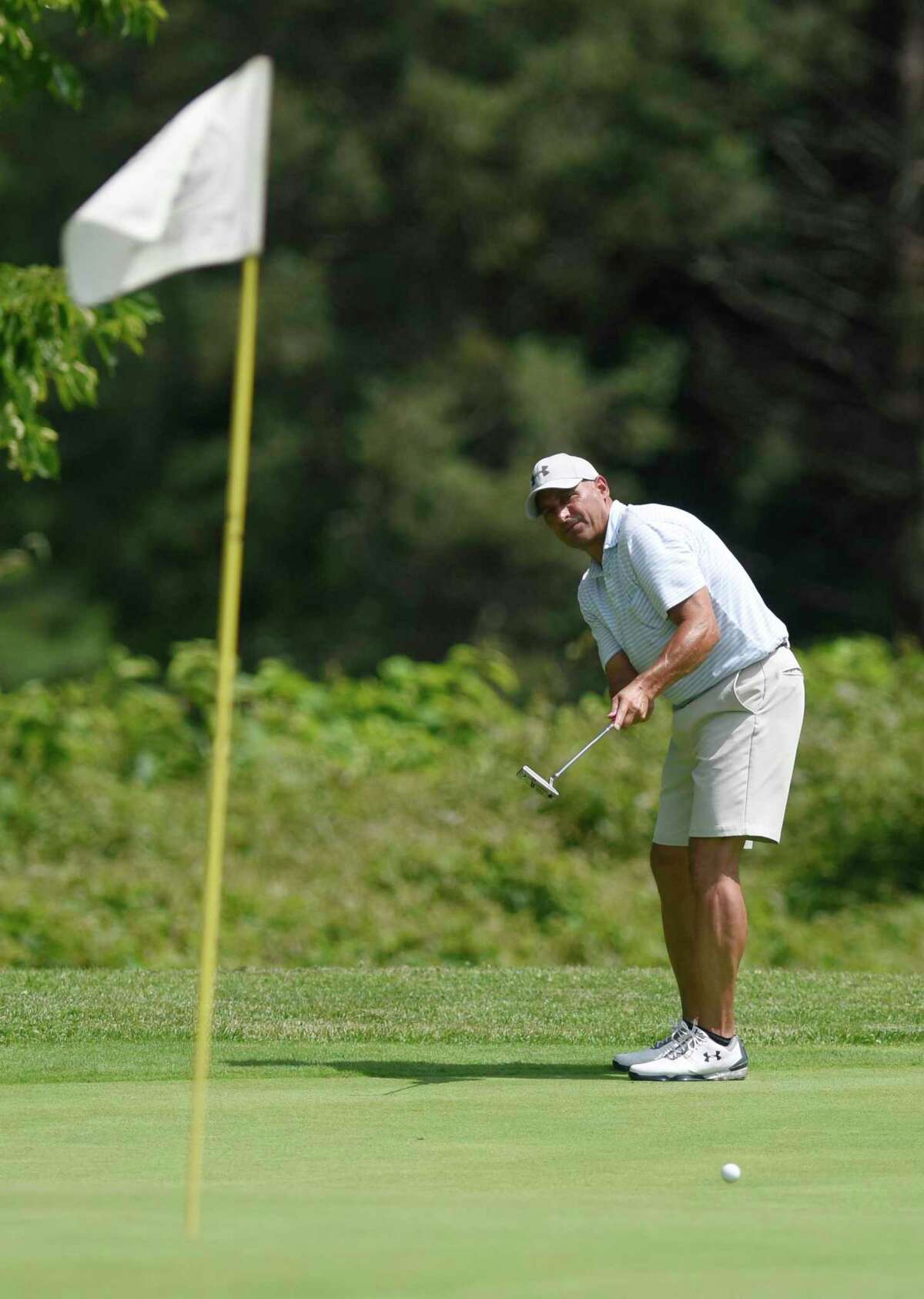 Joe Nethercott putts in the 76th Annual Town Wide Men's Golf Tournament at Griffith E. Harris Golf Course in Greenwich, Conn. Sunday, June 27, 2021. Nethercott won the Senior title.