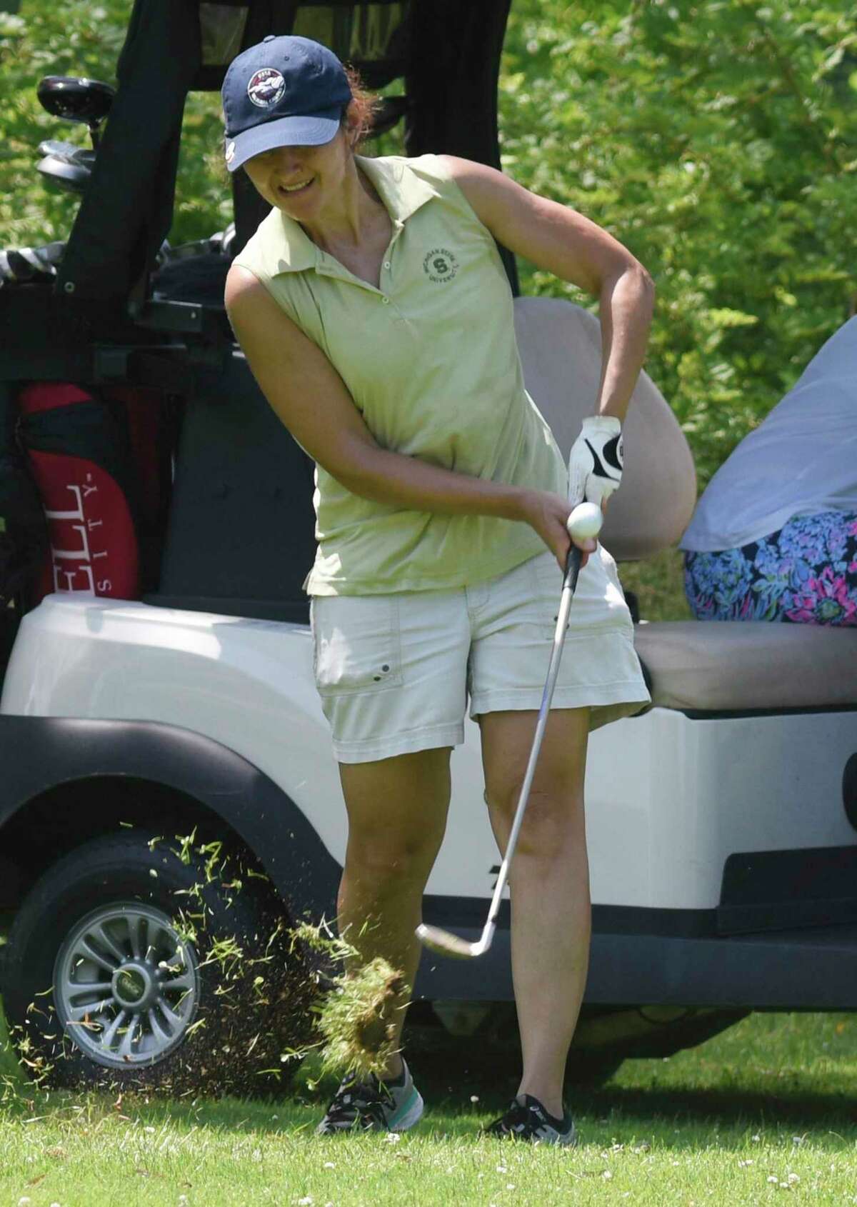 Olga Harvey hits an approach shot in the Town Wide Women's Golf Tournament at Griffith E. Harris Golf Course in Greenwich, Conn. Monday, June 28, 2021.