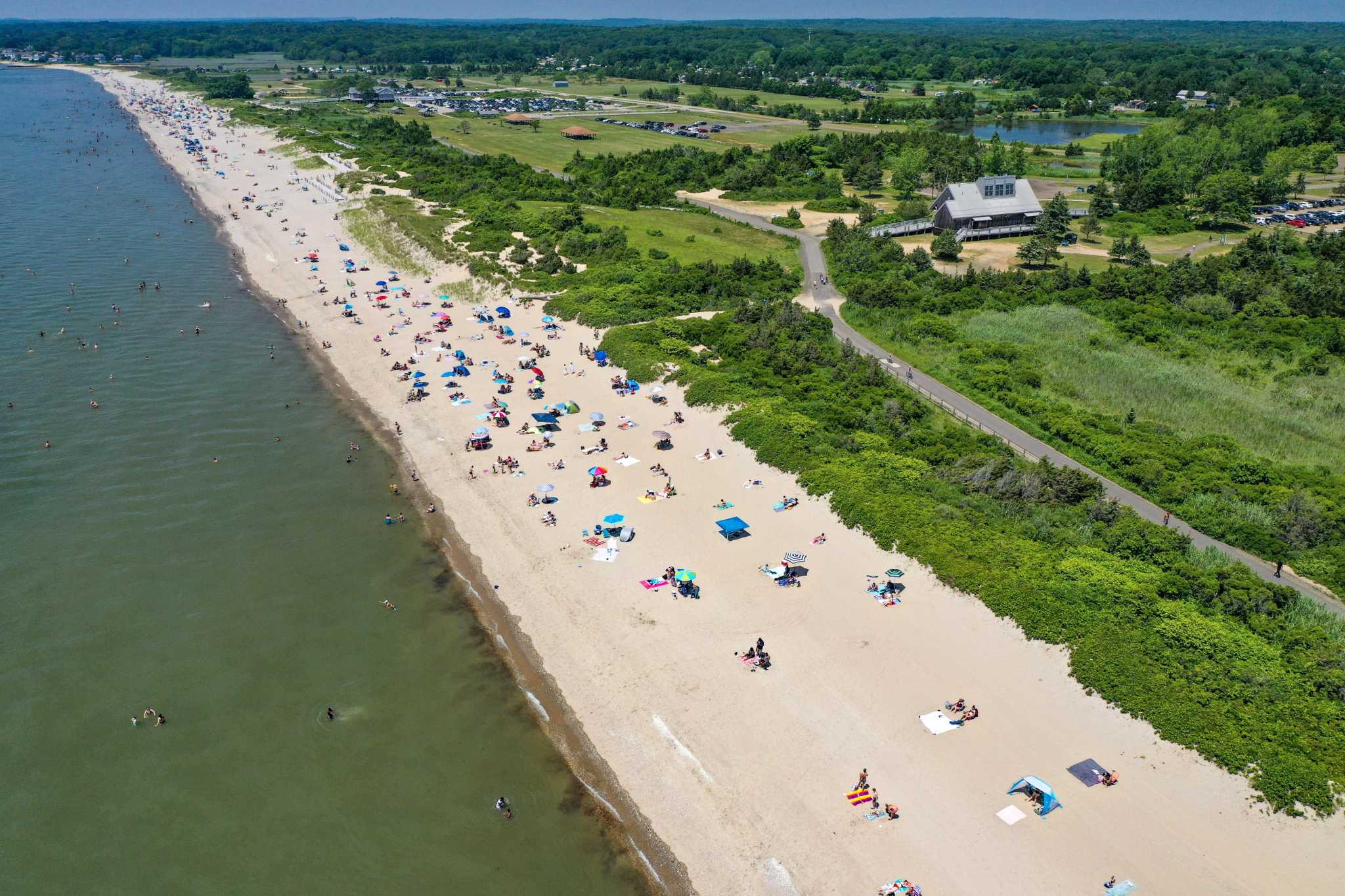 Drone photos Crowds gather at Madison beach as temperatures soar