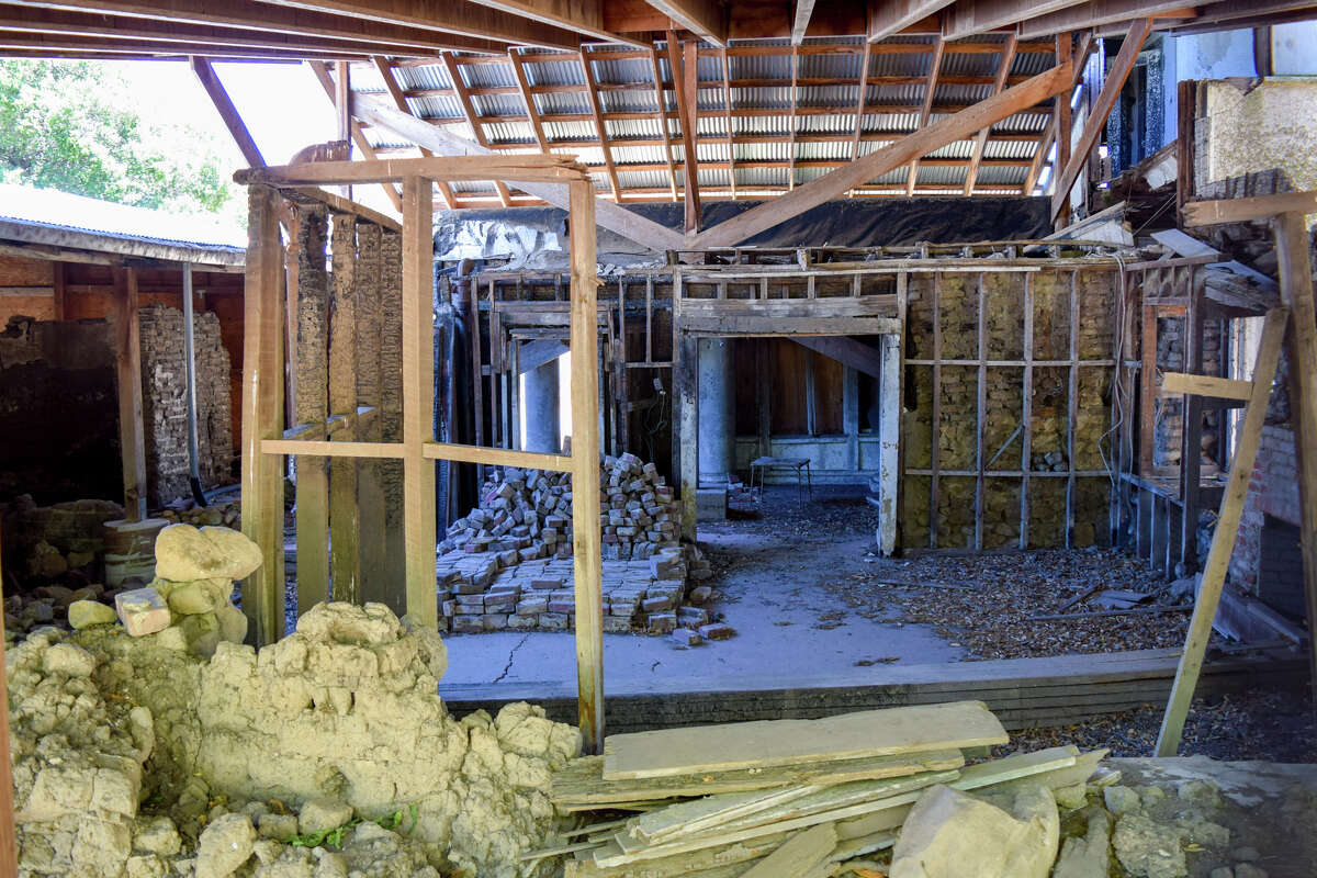 On the north side of the Burdell Mansion, visitors can see the three eras of the building come together: the original adobe, the Burdells' wooden house built around it, and the stucco mansion their son James built around it.
