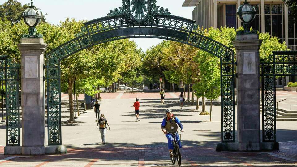 People walk through the UC Berkeley campus on Wednesday, July 8, 2020 in Berkeley, California.