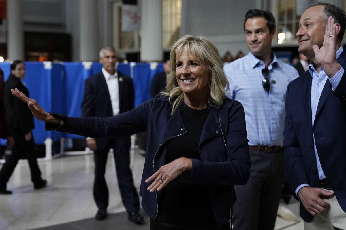 First lady Jill Biden and Doug Emhoff, husband of Vice President Kamala Harris, right, visit a vaccination event at Minute Maid Park, in Houston, Tuesday, June 29, 2021. (AP Photo/Carolyn Kaster, Pool)