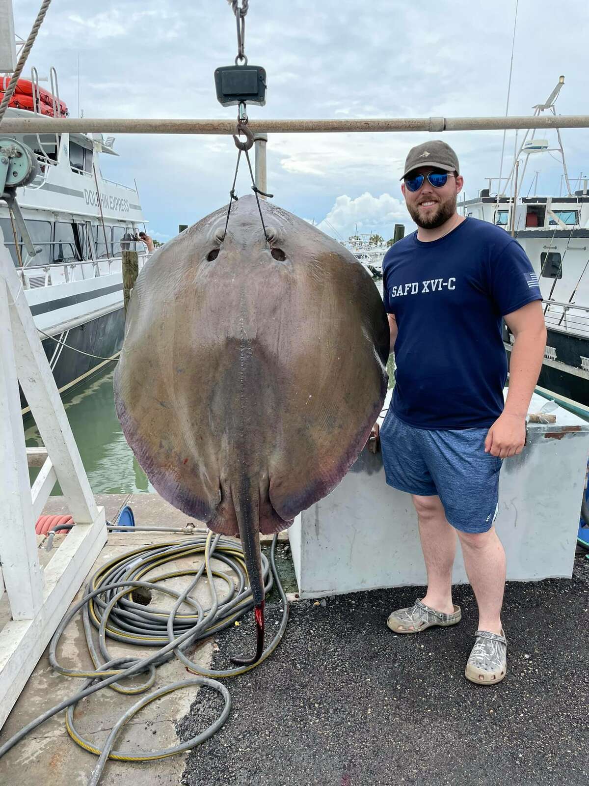 Hunter Schwarz, 25, reeled in a huge 152.5-pound Southern stingray while out on a 4-hour fishing trip with Dolphin Docks Deep Sea Fishing on Monday in Port Aransas. 
