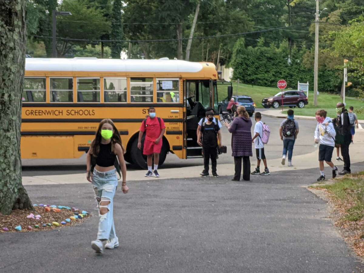 School buses dropped off students as scheduled for the start of classes on Wednesday and new regulations had it so kids wore masks on the bus and in class.