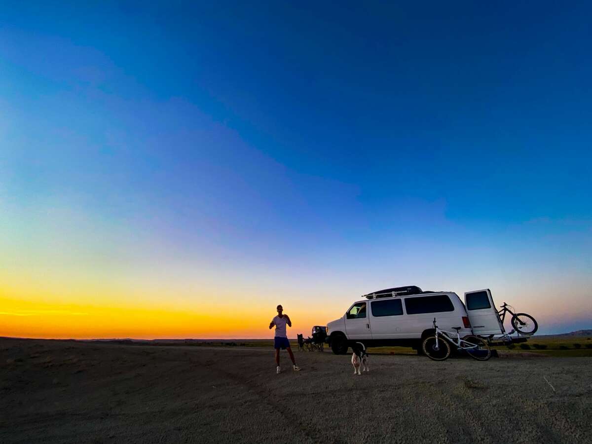 Alex Toombs and boyfriend Sam (pictured here in Bandlands National Park in South Dakota)  left their Bridgeport, Conn. life behind to move to Victoria Island, British Columbia and travel in a van to do so.