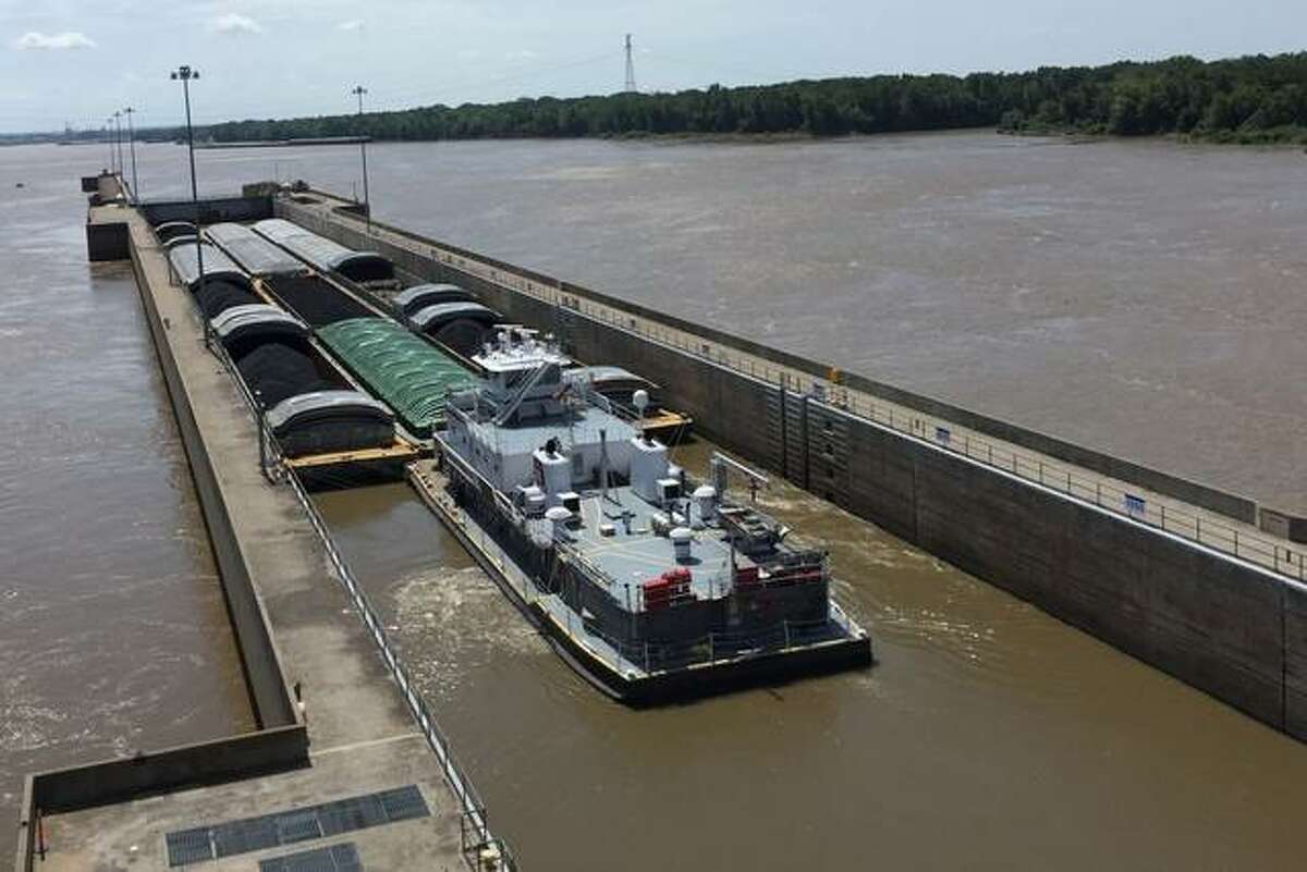 FILE — Barges move through the Melvin Price Locks and Dam in Alton in June 2021.