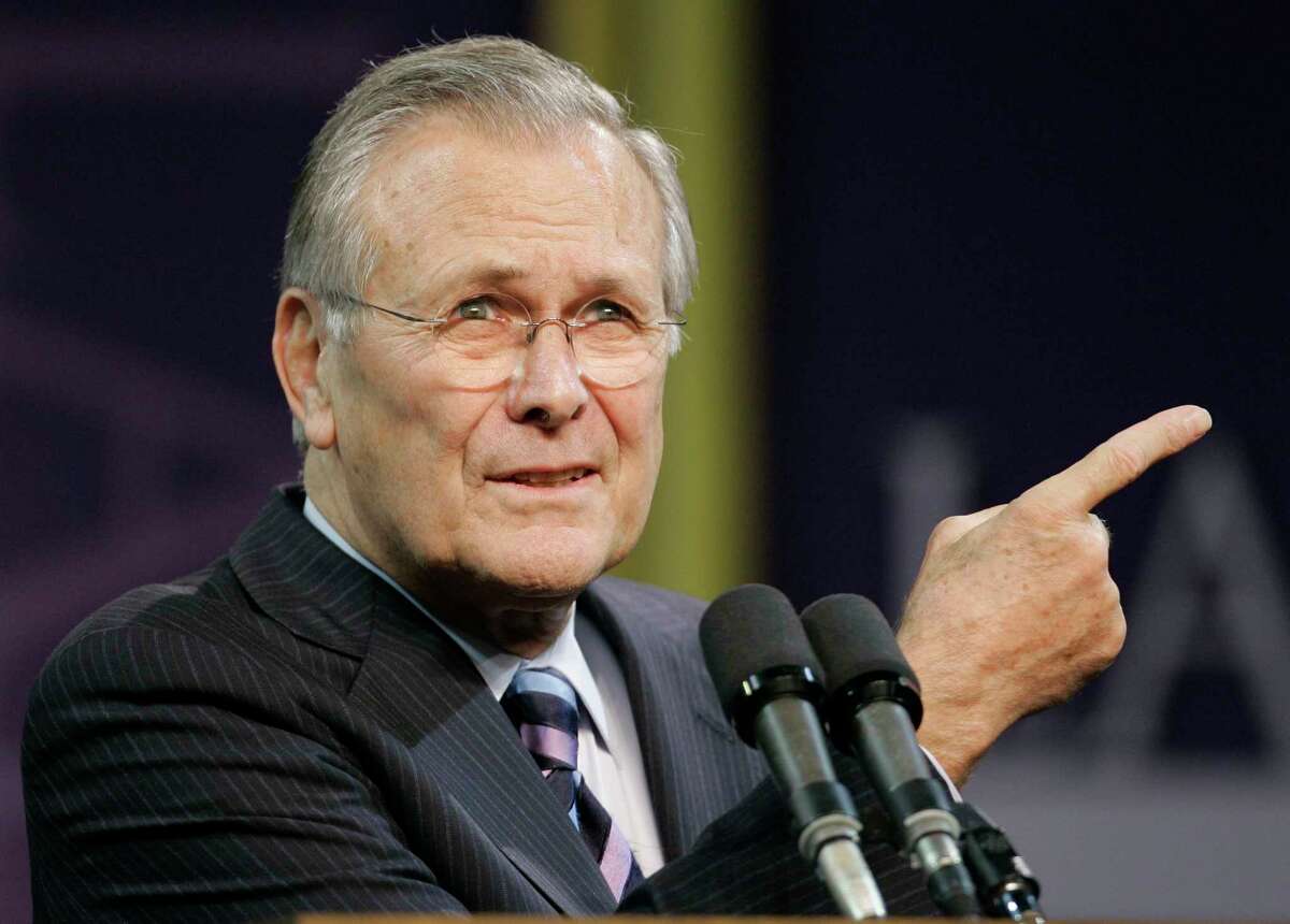In this Nov. 9, 2006, file photo, Defense Secretary Donald Rumsfeld asks for another question following his Landon Lecture at Kansas State University in Manhattan, Kan. The family of Rumsfeld says he died Tuesday, June 29, 2021. He was 88.