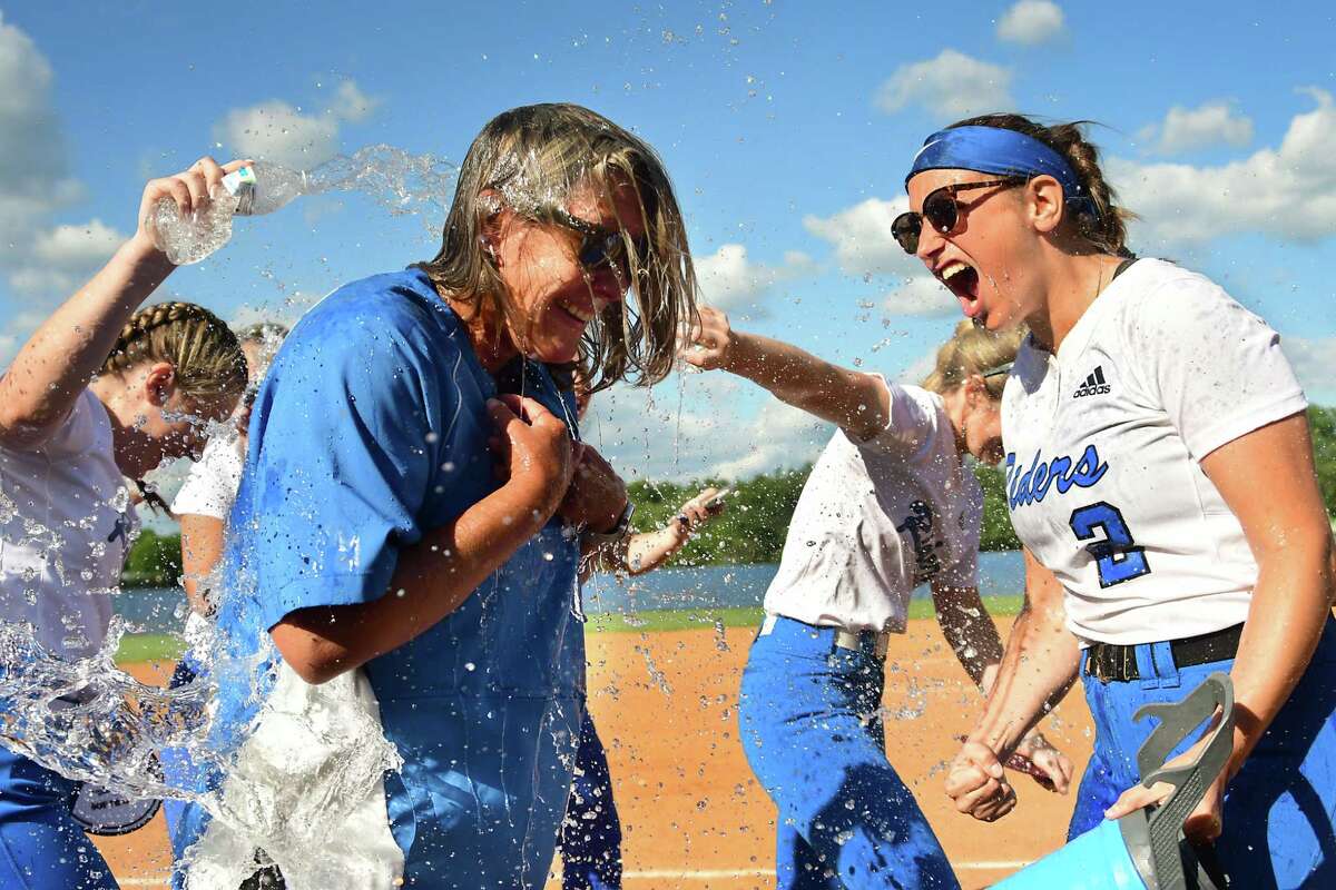 Distinguished Sports Photography: Ichabod Crane players pour water on coach Tracy Nytransky as they celebrate a win over Tamarac in the Class B final softball game on June 16, 2021, in Valatie. (Lori Van Buren/Times Union)