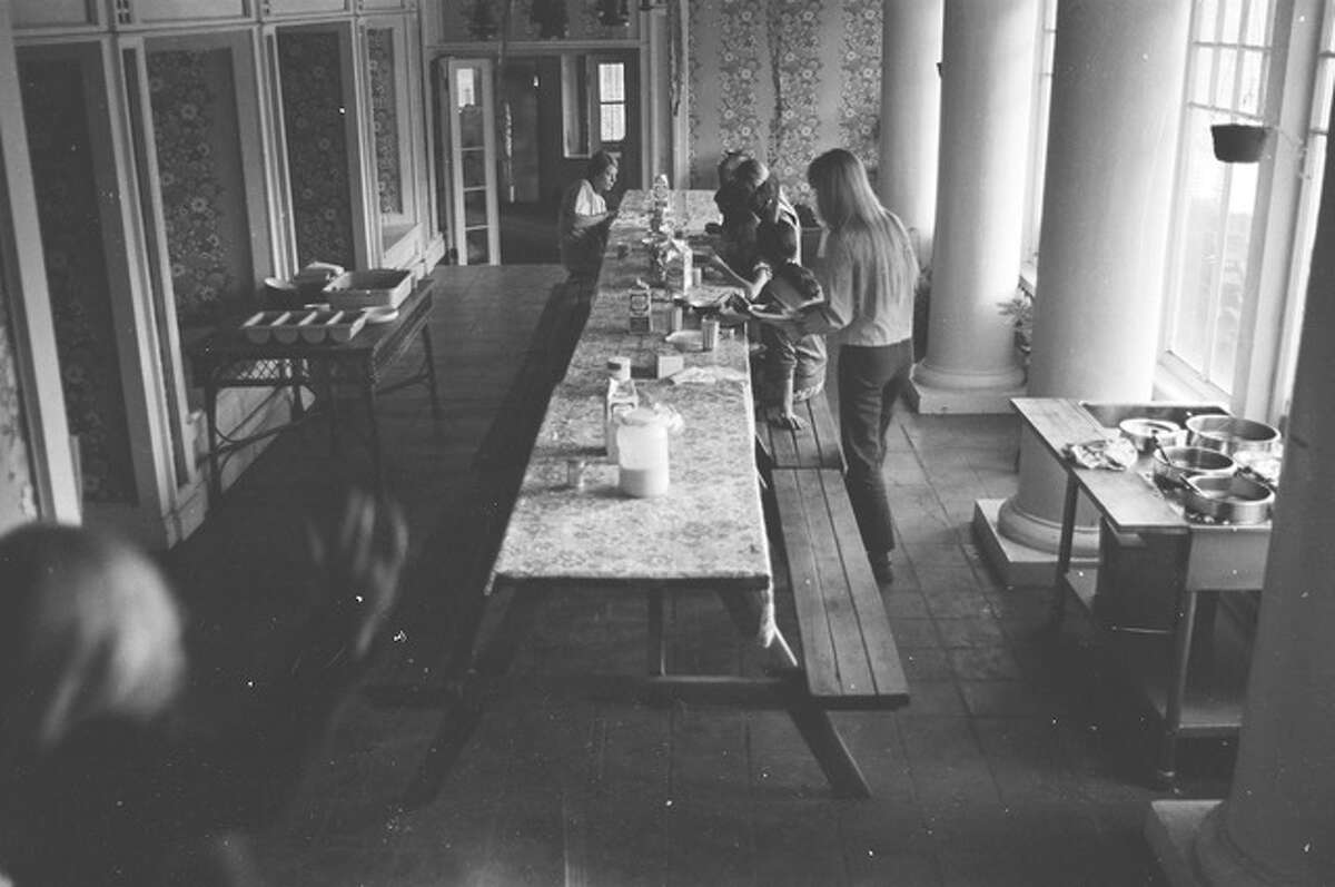 The dining room inside the Burdell Mansion during the chosen family's residence.