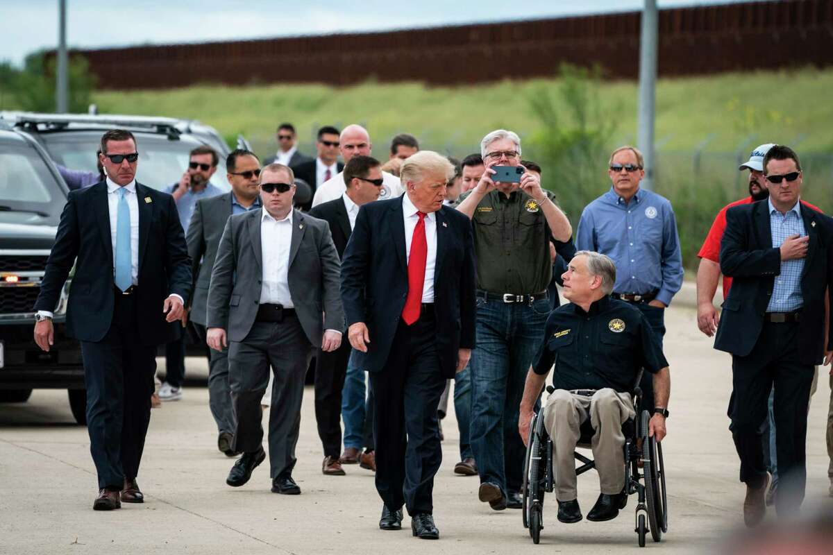 Former President Donald Trump and Texas Gov. Greg Abbott, R, arrive during a tour of the U.S.-Mexico border wall on June 30, 2021, in Pharr, Texas.