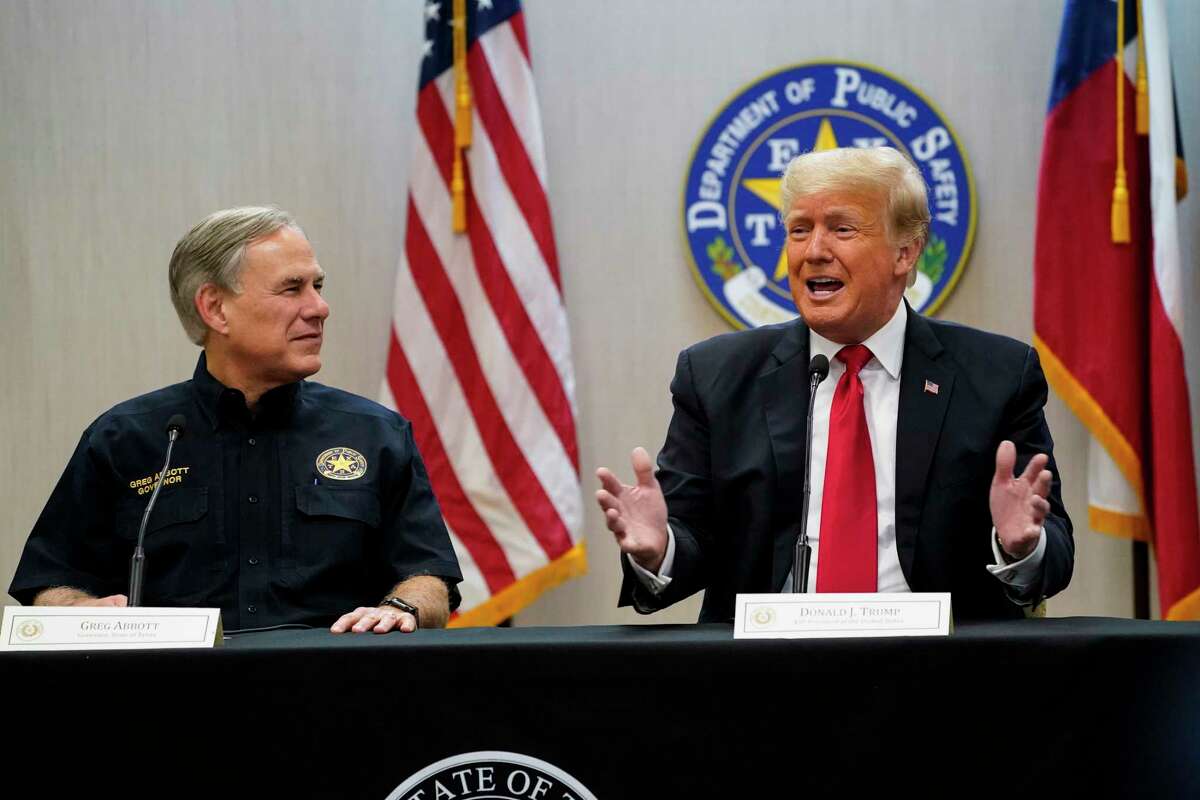 Texas Gov. Greg Abbott, R, and former President Donald Trump attend a security briefing with state officials before touring the U.S.-Mexico border wall on June 30, 2021, in Weslaco, Texas.