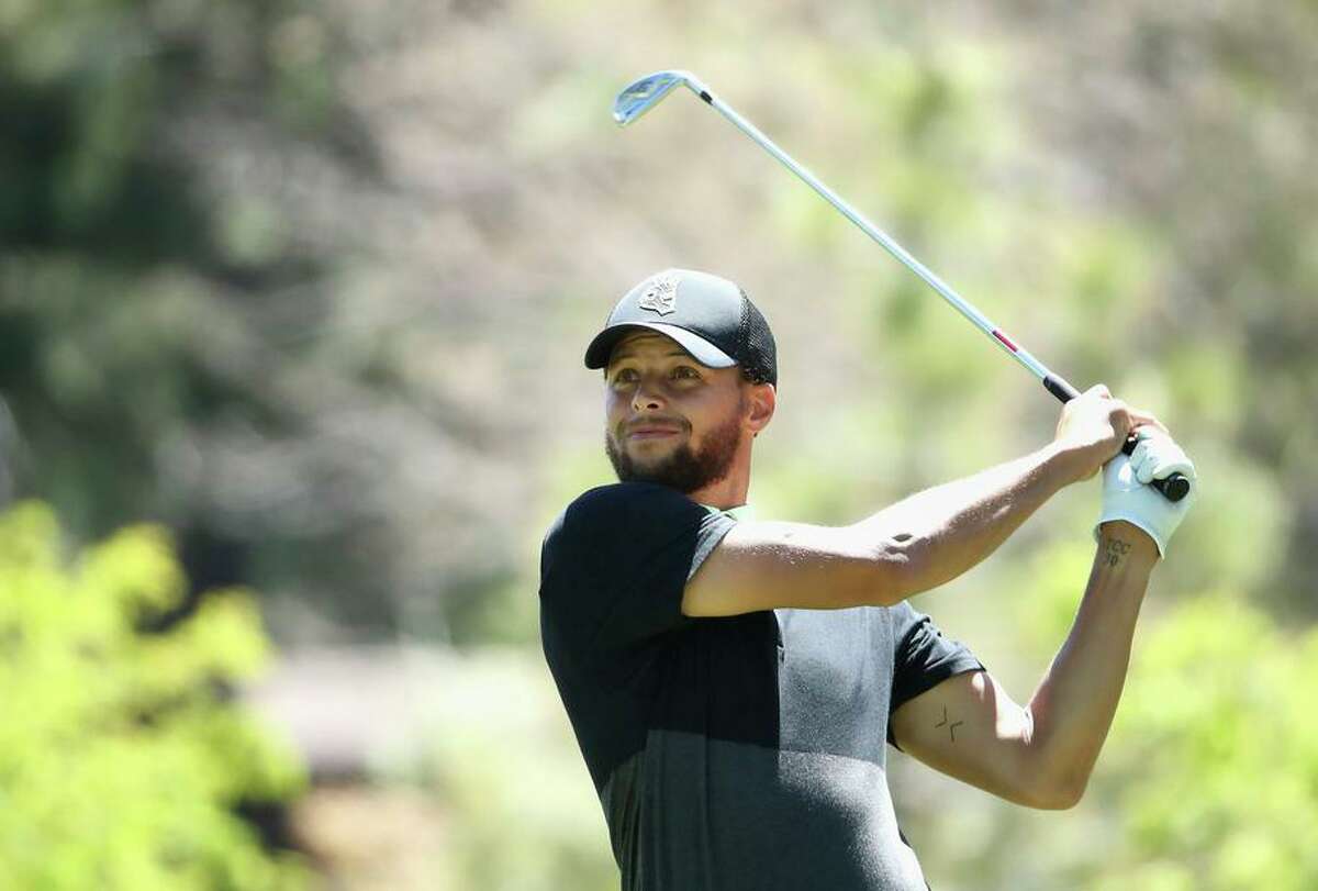 Warriors guard Stephen Curry hits a tee shot on the ninth hole during the American Century Championship at Edgewood Tahoe in July 2020.