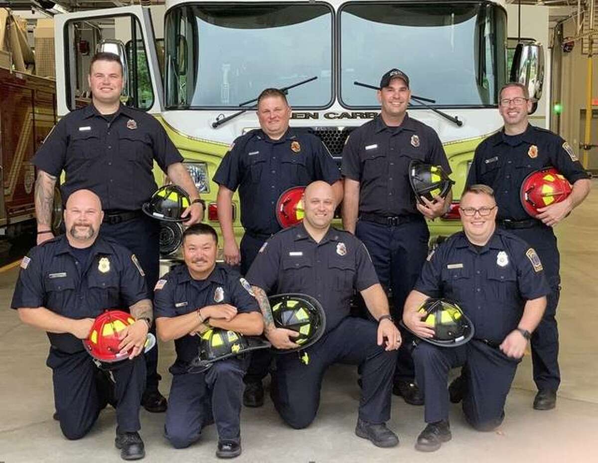 Recognition of training completions and appointments to Officer and Firefighter status were made at the Glen Carbon Fire Protection District’s June 29 meeting. From left are, front row, Captain Alex Campbell, FF/Paramedic Nathan Wahl, FF/Paramedic Chad VanRyn and FF/Paramedic James Schulte; back row, FF/Paramedic Camron Overholtz, Lieutenant Jason Reaka, FF/Paramedic Zack Napoli and Lt. Kiko Perez.