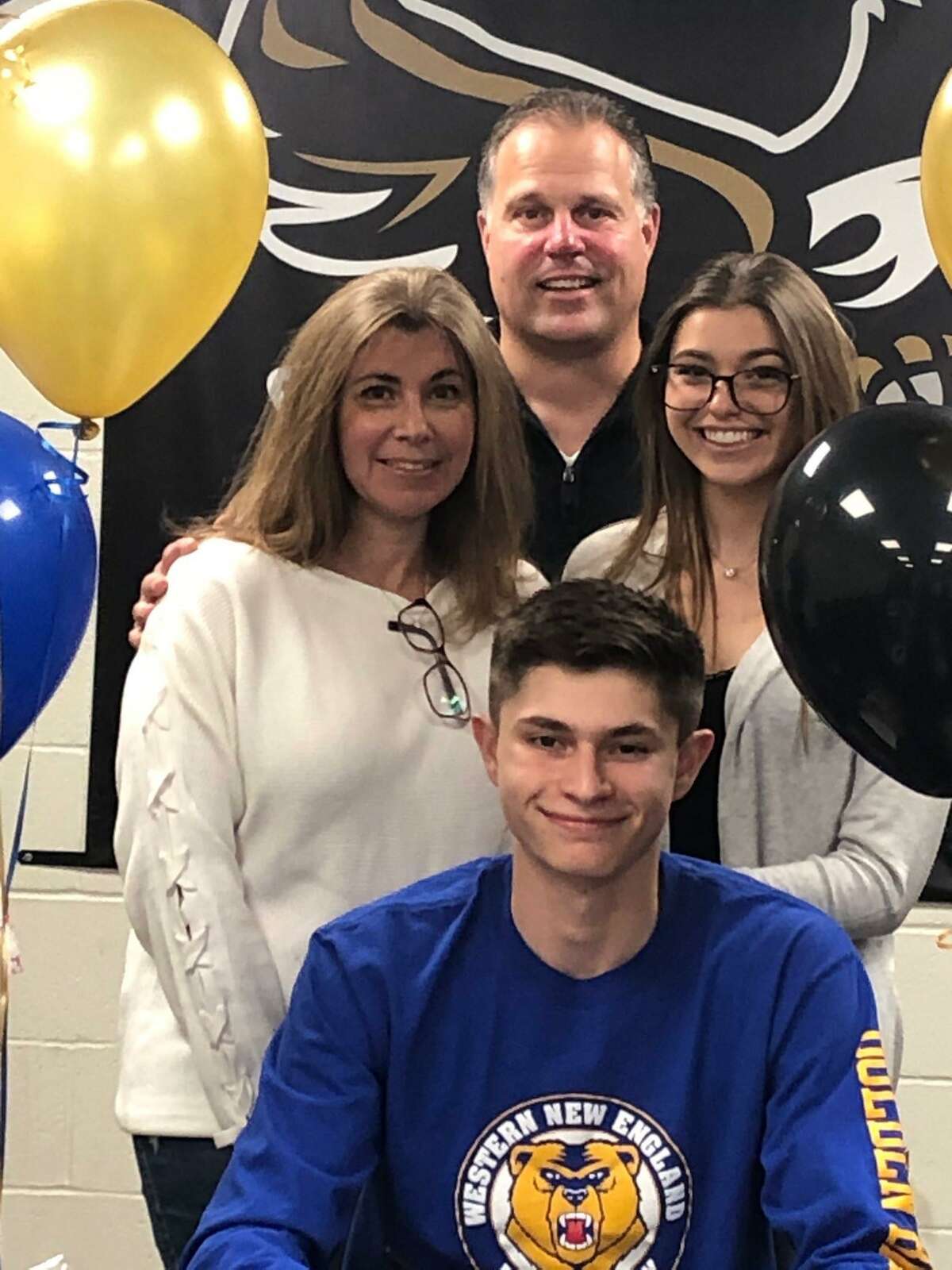 Johnny Bova is surrounded by mom Alice, dad John and sister Gabby when he signed a letter of intent to play baseball at Western New England University.