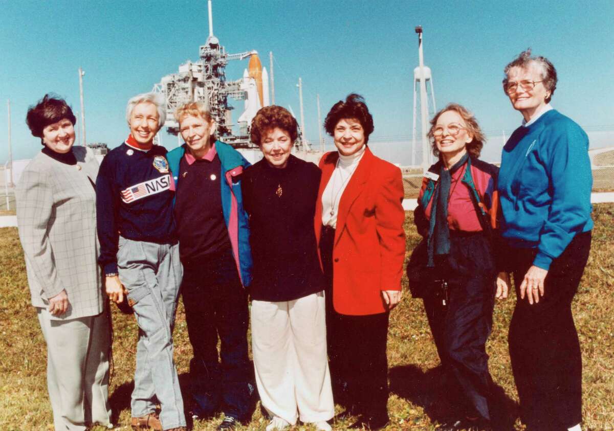 FILE - In this 1995 file photo, members of the FLATs, also known as the Mercury 13, gather for a photo as they attend a shuttle launch in Florida. From left are Gene Nora Jessen, Wally Funk, Jerrie Cobb, Jerri Truhill, Sarah Rutley, Myrtle Cagle and Bernice Steadman. Blue Origin's Jeff Bezos has chosen Funk, an early female aerospace pioneer, to rocket into space with him later this month. The company announced Thursday, July 1, 2021, that Funk will be aboard the July 20 launch from West Texas, flying as an “honored guest.” Funk, along with the other women of Mercury 13, went through astronaut training in the 1960s, but never made it to space - or even NASA's astronaut corps - because of their gender. (NASA via AP)