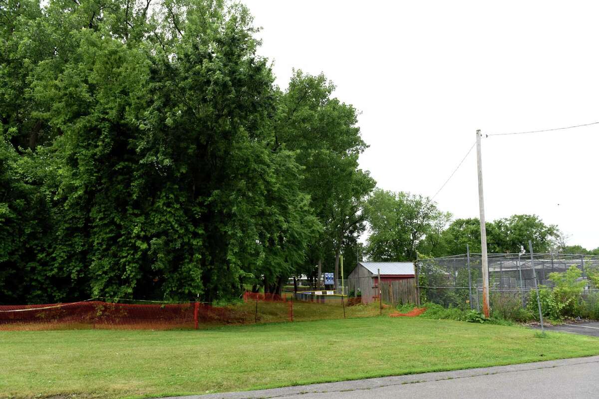 An area of land behind a baseball field at Woodlawn Park is cordoned off after possible asbestos from construction waste was discovered on Thursday, July 1, 2021, in Albany, N.Y. (Will Waldron/Times Union)