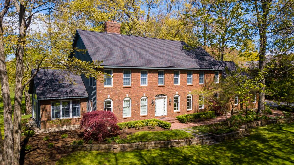 This week’s house is a 4,432-square-foot, brick Colonial on an acre bordering the Schuyler Meadows Golf Club. Built in 1994, the house is decorated in a deeply traditional style. There is a formal dining room and living room with a fireplace as well as a sitting room with a second, brick fireplace. Dentil mouldings and wainscotting panels are abundant. A bathroom on the second floor contains a stand-alone tub under a large, round window; a pocket door conceals the toilet. Four bedrooms in all; three full bathrooms and two half-baths. There are three bays in the garage. A stone patio out back overlooks a treed yard and the golfing greens beyond. North Colonie schools. Taxes: $31,729. List price: $1.35 million. Contact listing agent Steven Girvin of Howard Hanna at 518-852-1315. https://realestate.timesunion.com/listings/6-East-Ridge-Rd-Colonie-NY-12211-MLS-202111090/48536123